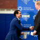 New York Giants General Manager Joe Schoen, left, shakes hands with CEO and co-owner John Mara during Schoen's introductory press conference at the Quest Diagnostics Training Center on Wednesday, Jan. 26, 2022.